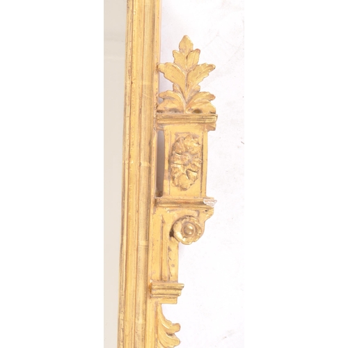 244 - An early 19th century Regency giltwood hall wall mirror having a florally carved top cresting flanke... 