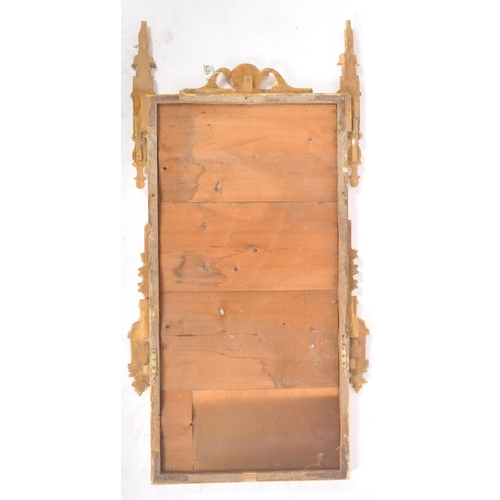 244 - An early 19th century Regency giltwood hall wall mirror having a florally carved top cresting flanke... 