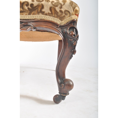 285 - A Victorian 19th century walnut nursing - ladies chair. The chair having a pierced foliate top & bac... 