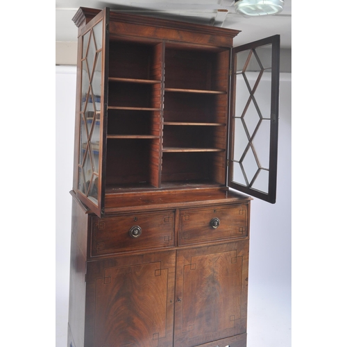 296 - A 19th century George III flame mahogany glazed library bookcase cabinet. The bookcase having a flar... 