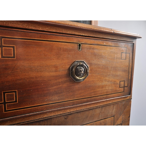 296 - A 19th century George III flame mahogany glazed library bookcase cabinet. The bookcase having a flar... 