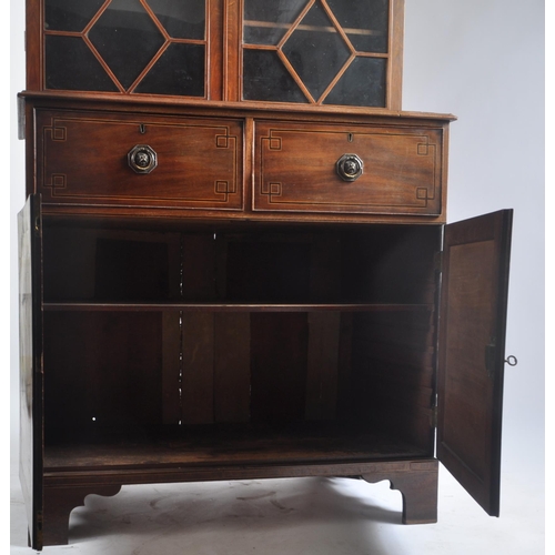 296 - A 19th century George III flame mahogany glazed library bookcase cabinet. The bookcase having a flar... 