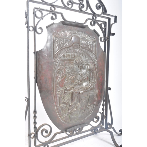 354 - A late 19th century Victorian Arts & Crafts copper embossed fire screen panel held within a wrought ... 