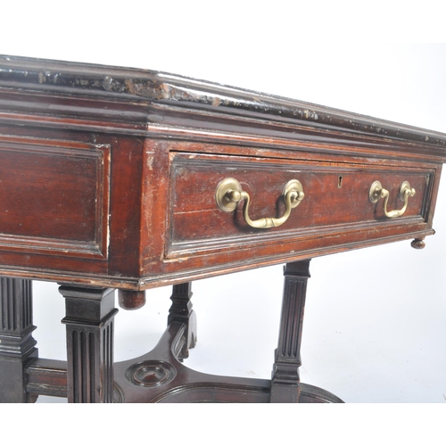 396 - A Victorian late 19th century circa 1880s flame mahogany rent octagonal table desk. The table having... 