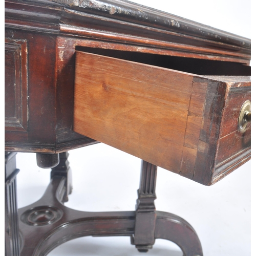 396 - A Victorian late 19th century circa 1880s flame mahogany rent octagonal table desk. The table having... 