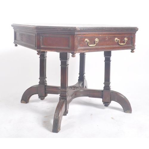 396 - A Victorian late 19th century circa 1880s flame mahogany rent octagonal table desk. The table having... 