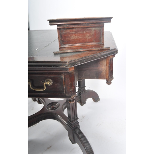 396 - A Victorian late 19th century circa 1880s flame mahogany rent octagonal table desk. The table having... 