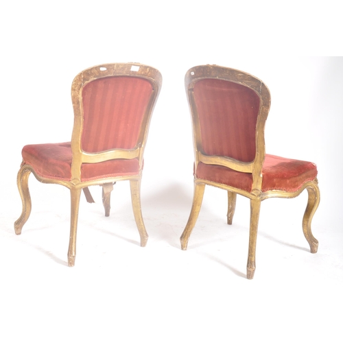 403 - A pair of early Victorian 18th century gilt wood & upholstered English dining chairs. Each chair hav... 