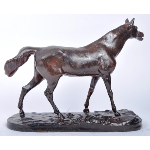 666 - A 20th century plaster study of a horse in motion. The horse painted with a bronze finish and mounte... 