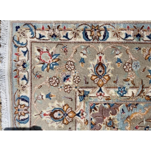 214 - An early 20th century North East Persian Islamic Meshed hand woven floor carpet rug. The rug having ... 