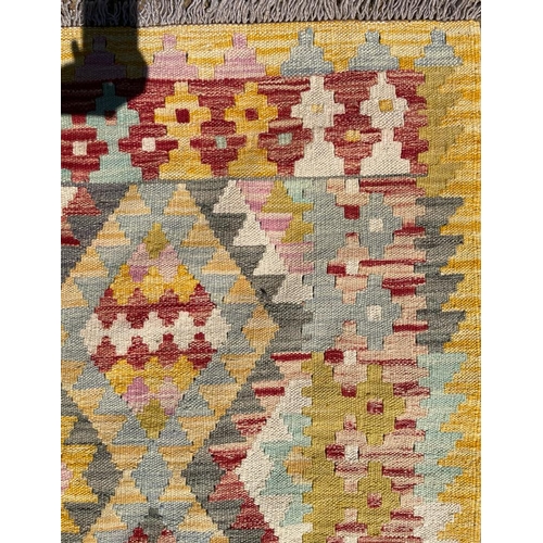 329 - A 20th century Anatolian Turkish Islamic Kilim hand woven floor carpet rug. The rug having a central... 