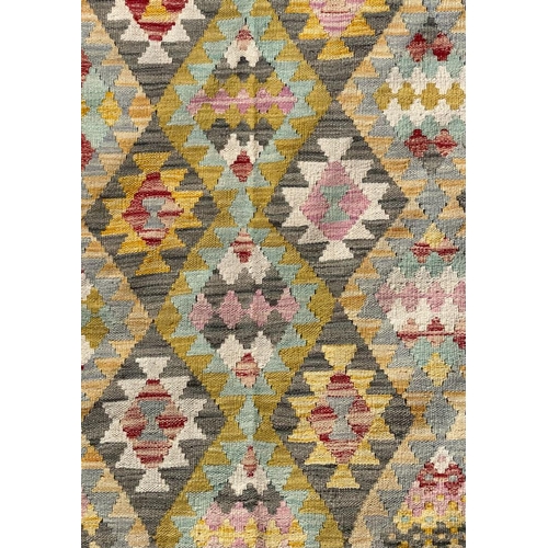 329 - A 20th century Anatolian Turkish Islamic Kilim hand woven floor carpet rug. The rug having a central... 