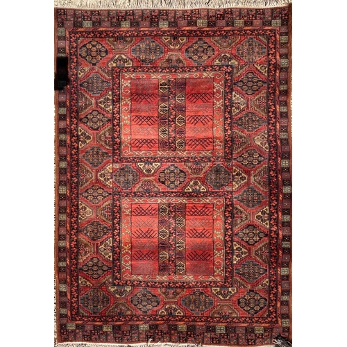 399 - An early 20th century Persian Islamic Bukhara hand woven floor carpet rug. The rug having two centra... 