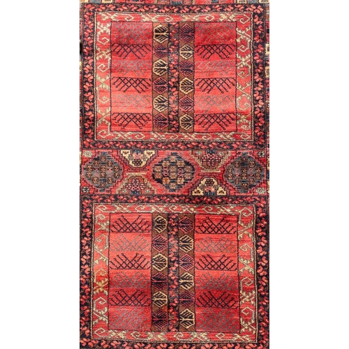 399 - An early 20th century Persian Islamic Bukhara hand woven floor carpet rug. The rug having two centra... 