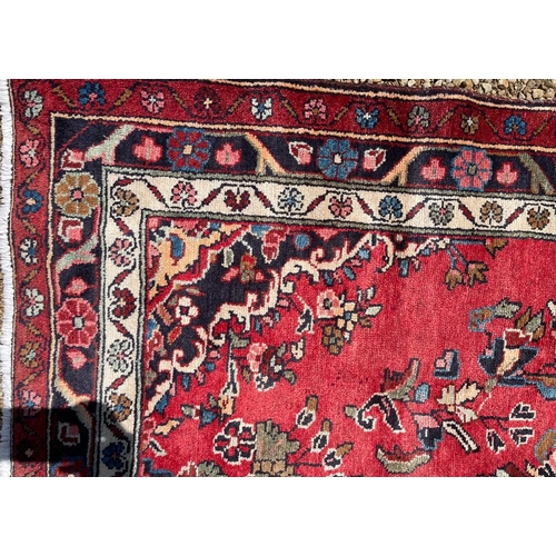 667 - An early 20th century North West Persian Islamic Mahal hand woven floor carpet runner rug. The rug h... 