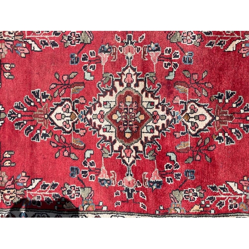 667 - An early 20th century North West Persian Islamic Mahal hand woven floor carpet runner rug. The rug h... 