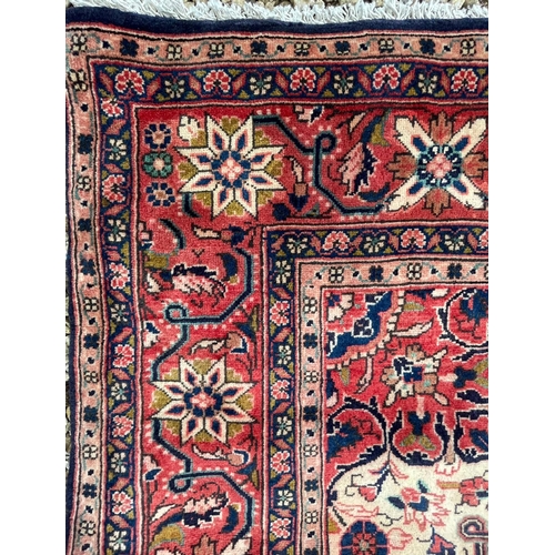 41 - A 19th century North West Persian Islamic Sarouk hand woven floor carpet rug, having a cobalt medall... 