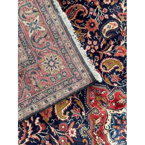 41 - A 19th century North West Persian Islamic Sarouk hand woven floor carpet rug, having a cobalt medall... 