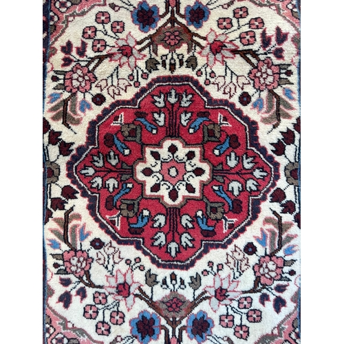 187 - An early 20th century North West Persian Islamic Rudbar hand woven floor runner rug having a series ... 