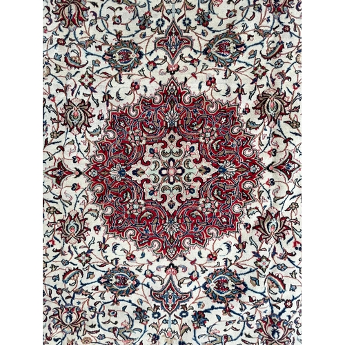 444 - An early 20th century North West Persian Islamic Sarouk hand woven floor carpet rug having a central... 