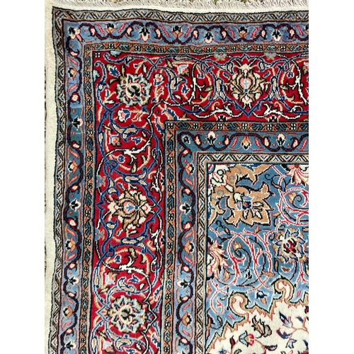 444 - An early 20th century North West Persian Islamic Sarouk hand woven floor carpet rug having a central... 