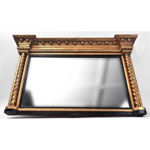 17 - A 19th century giltwood and gesso framed overmantel mirror. The mirror having flyaway cornice over b... 