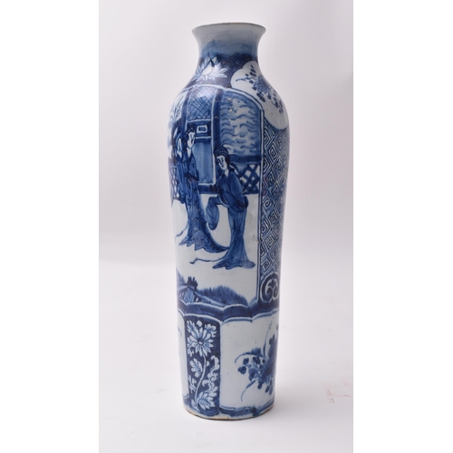 655 - A 19th century blue and white transfer and hand painted vase. The vase having a lipped rim with tape... 