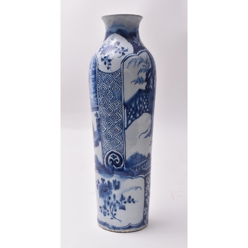 655 - A 19th century blue and white transfer and hand painted vase. The vase having a lipped rim with tape... 