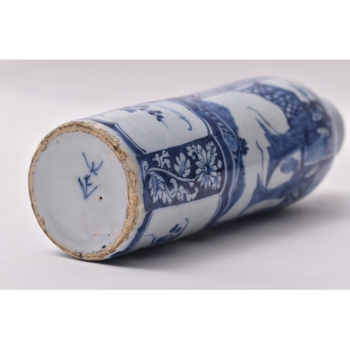 655 - A 19th century blue and white transfer and hand painted vase. The vase having a lipped rim with tape... 