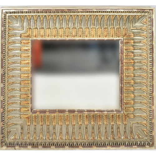 125 - A large 20th century Regency Revival resin wall hanging hall mirror. The mirror having a bevelled fr... 