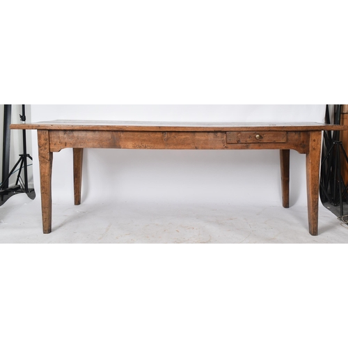 70 - A 19th century country house elm refectory dining / kitchen table. The table having large elm rectan... 