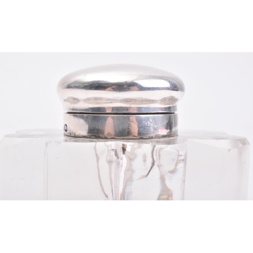 207 - A Victorian hallmarked silver lidded glass inkwell. The ink well in the form of a three leaved clove... 