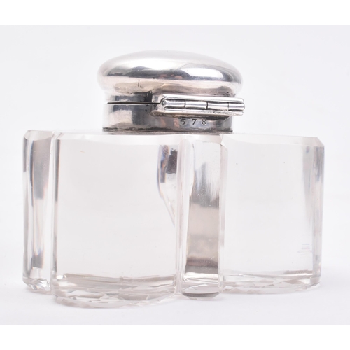 207 - A Victorian hallmarked silver lidded glass inkwell. The ink well in the form of a three leaved clove... 