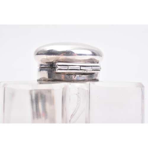 207 - A Victorian hallmarked silver lidded glass inkwell. The ink well in the form of a three leaved clove... 