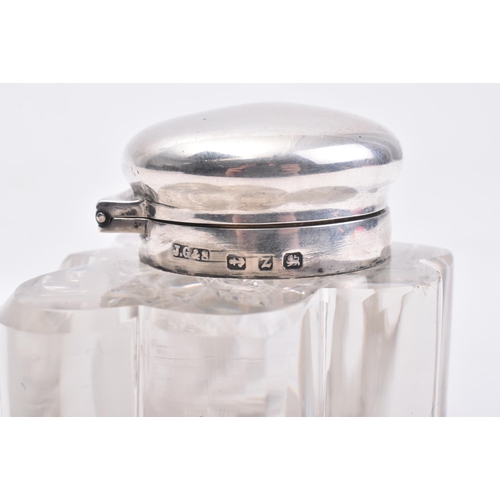 207 - A Victorian hallmarked silver lidded glass inkwell. The ink well in the form of a three leaved clove... 