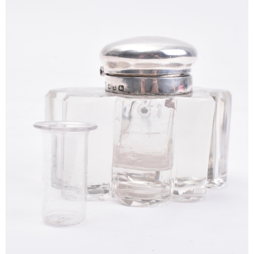 207 - A Victorian hallmarked silver lidded glass inkwell. The ink well in the form of a three leaved clove... 