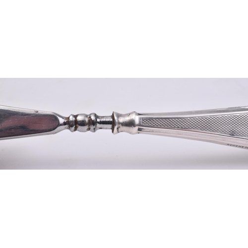 25 - A hallmarked silver handled stainless steel shoe horn. The main body of the shoe horn made from stai... 