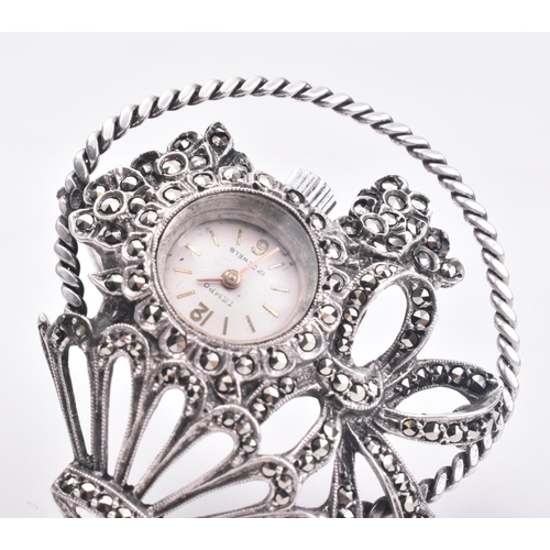 27 - A hallmarked silver and marcasite giardinetto brooch pin watch. The brooch in the form of a flower b... 