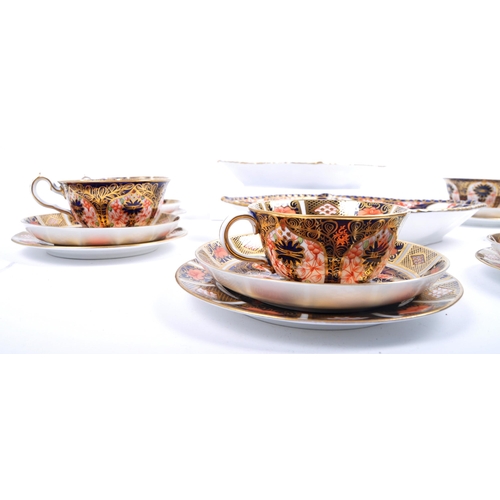 331 - Royal Crown Derby - A collection of 20th century Imari pattern porcelain comprising six cups, saucer... 