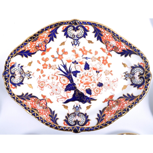 331 - Royal Crown Derby - A collection of 20th century Imari pattern porcelain comprising six cups, saucer... 