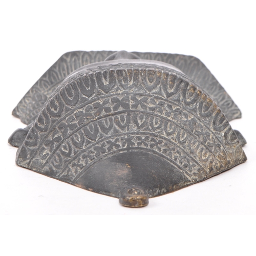 249 - A 20th Century cast ebonised brass Khmer Cambodian Buddha deity wall face mask, with detailed facial... 