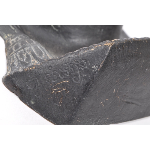 249 - A 20th Century cast ebonised brass Khmer Cambodian Buddha deity wall face mask, with detailed facial... 