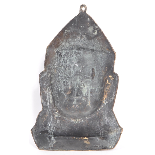 249 - A 20th Century cast ebonised brass Khmer Cambodian Buddha deity wall face mask, with detailed facial... 
