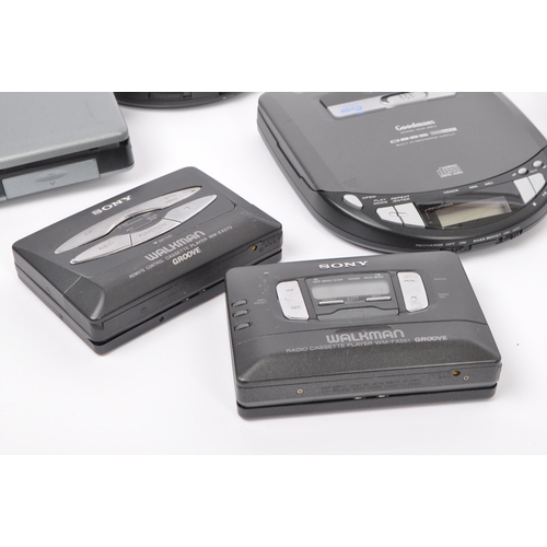 402 - A collection of vintage retro 20th Century cassette and compact disc players. Lot to include Walkman... 