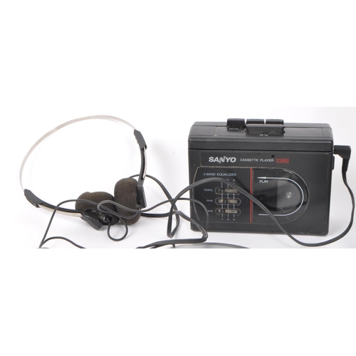 402 - A collection of vintage retro 20th Century cassette and compact disc players. Lot to include Walkman... 