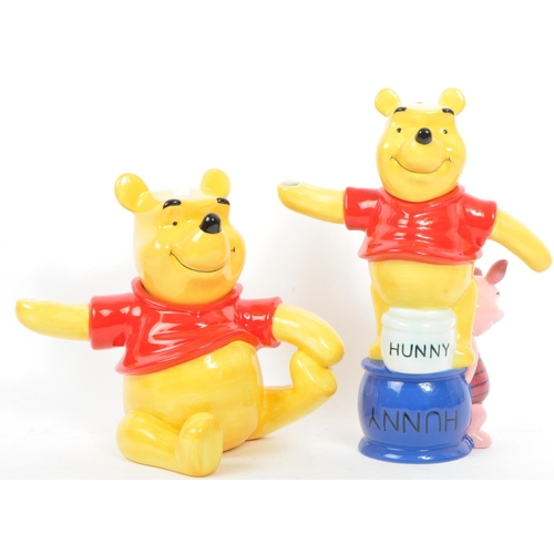 71 - A collection of six Border Fine Arts studio china porcelain Winnie the Pooh novelty with mark to bas... 