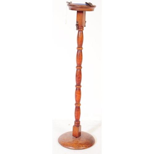 348 - A vintage 20th century mahogany pedestal free standing floor standing ashtray. The ashtray having me... 