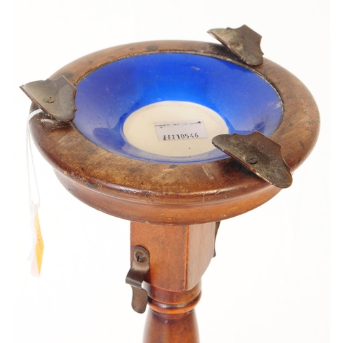 348 - A vintage 20th century mahogany pedestal free standing floor standing ashtray. The ashtray having me... 