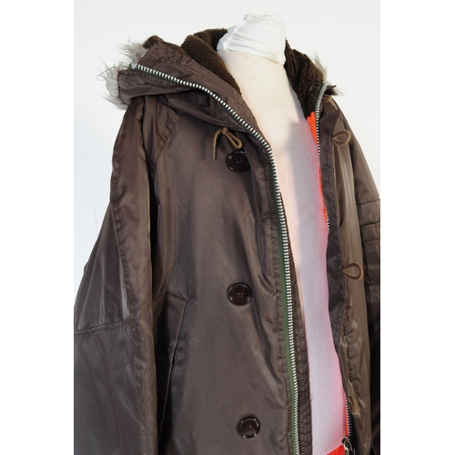 A vintage 1980 s Parka jacket in earth brown with orange lining. Medium in size to fit 97 102cm Ch