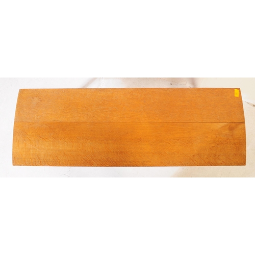 581 - British Modern Design - A mid 20th century circa 1960s teak Long John coffee table having shaped top... 